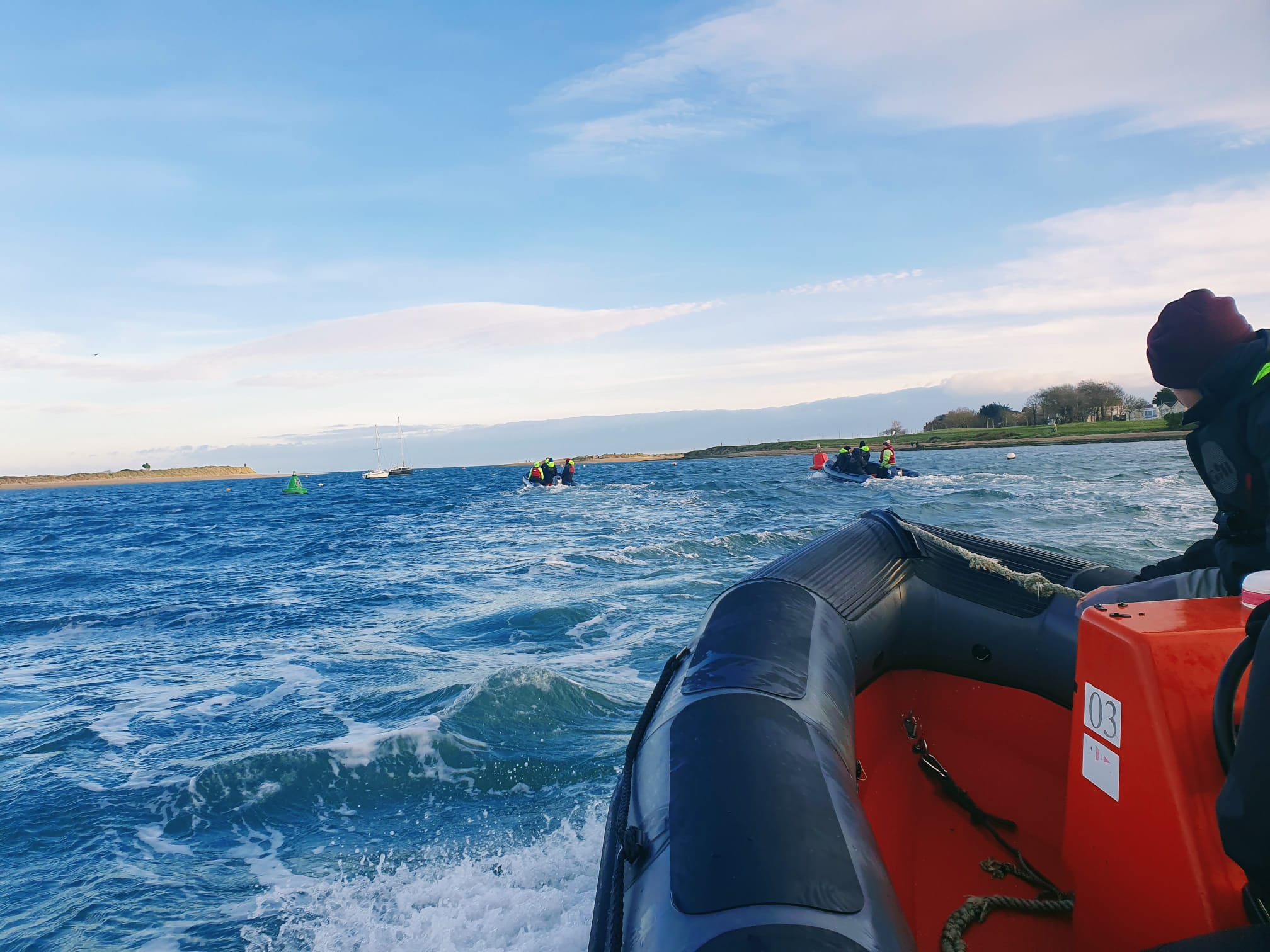 Group of students taking part in the Irish Sailing National Powerboat Certificate course on a powerboat in Dublin