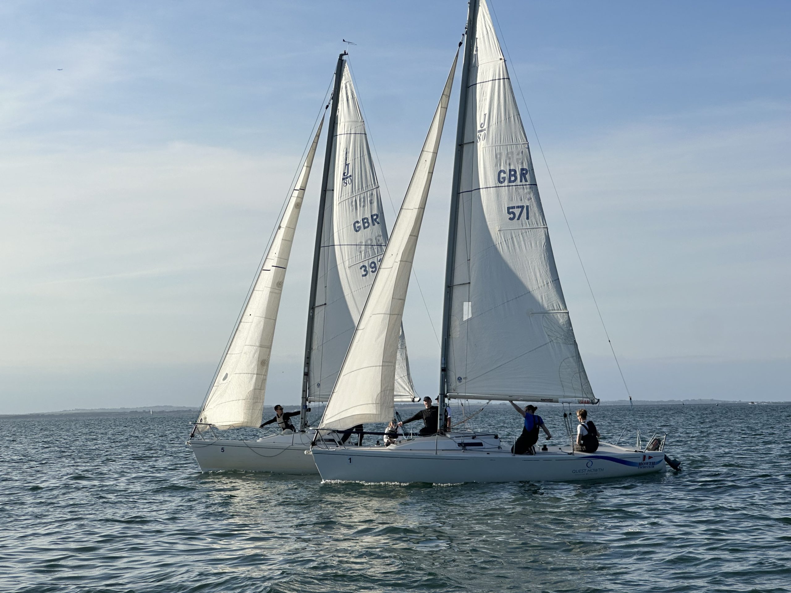 Beginner sailors practicing boat handling and navigation during the Learn to Sail course in Howth Sound with Quest Howth